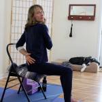 Renee Le Verrier teaches an online yoga class for people with movement disorders from her studio in Oak Harbor. In the background taking a nap is her service dog, a Great Dane named Tommy. Photo by Patricia Guthrie/Whidbey News-Times