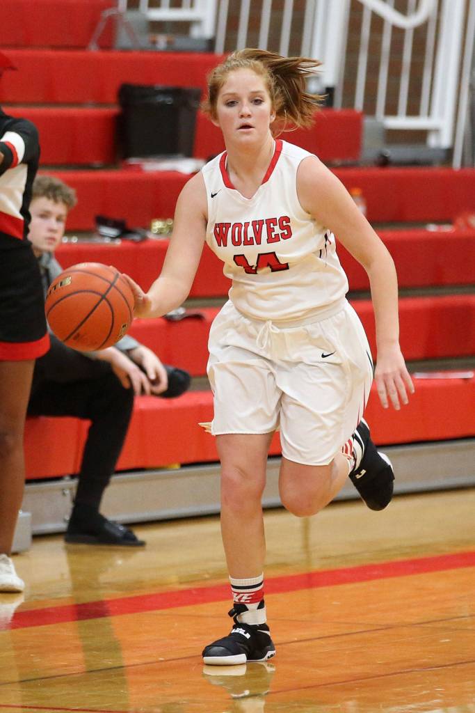 Ema Smith hustles the ball up the court for the Wolves.(Photo by John Fisken)