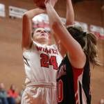 Lindsey Roberts shoots over the defense of Port Townsends Cece Nielsen.(Photo by John Fisken)