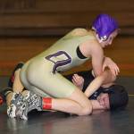 Autumn Coker, top, tries to turn her opponent.(Photo by John Fisken)