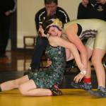 Oak Harbors Taylor Cress, right, works to prevent her opponent from escaping.(Photo by John Fisken)
