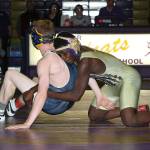 Jeremiah Dailey, right, tries to stay in control of Arlingtons Brantly Stupey.(Photo by John Fisken)