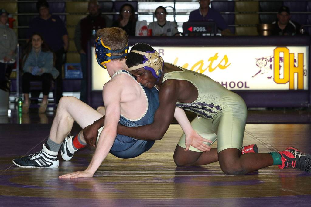 Jeremiah Dailey, right, tries to stay in control of Arlingtons Brantly Stupey.(Photo by John Fisken)