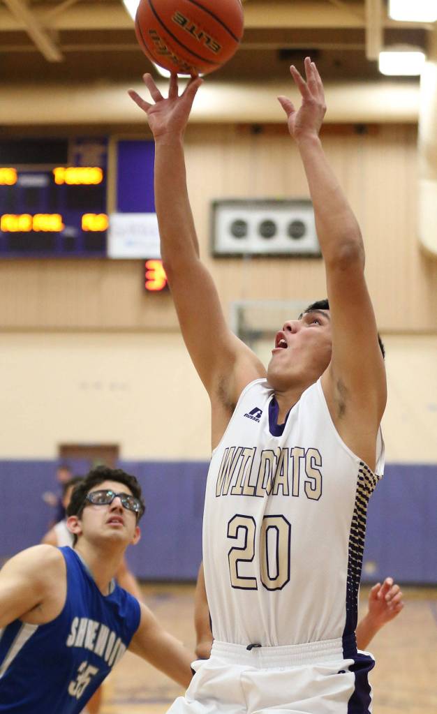 Oalk Harbors Weston Whitefoot puts up a shot after collecting an offensive rebound against Shorewood earlier this month.(Photo by John Fisken)