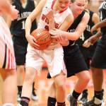 Coupevilles Scout Smith wrestles the ball away from Karli Eberhart.(Photo by John Fisken)