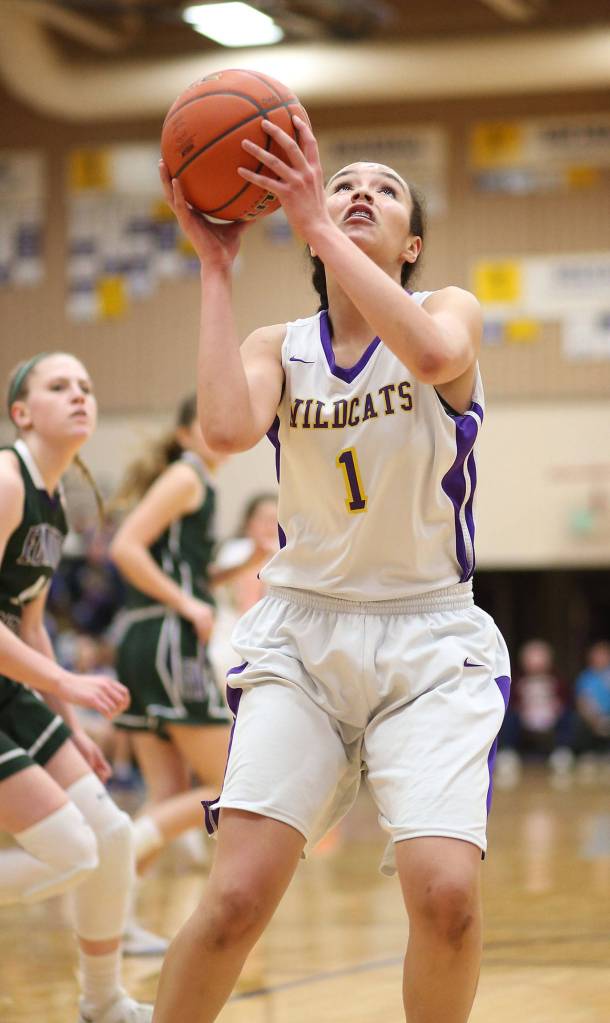 Jasmine Ford goes up on a putback for the Wildcats.(Photo by John Fisken)