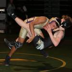 Jamal Graham takes down Getchells Timothy Doroshuk Thursday. Graham went on to win 11-9. (Photo by John Fisken)