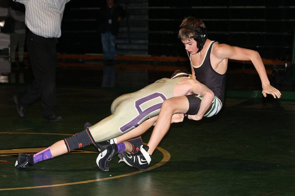 Blake Servatius, left, wins by a fall after this takedown at Marysville Getchell.(Photo by John Fisken)