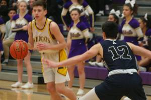 Arlington holds off hard-charging Oak Harbor / Boys basketball