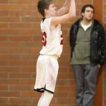 Mason Grove launches one of his four successful three-point shots against Chimacum.(Photo by John Fisken)