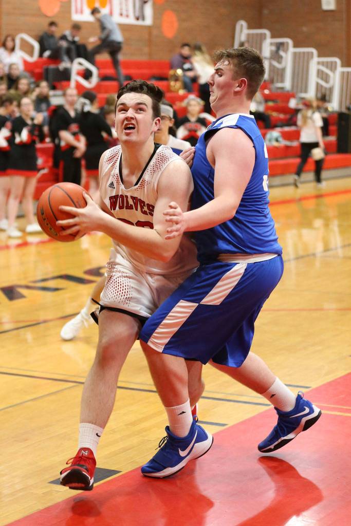 Coupevilles Kyle Rockwell, left, muscles by Chimacums Jacob Williamson.(Photo by John Fisken)