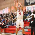 Hunter Smith puts up a jumper for the Wolves Friday. Smith scored 20 points and is now the 14th leading scorer in Coupeville history.(Photo by John Fisken)