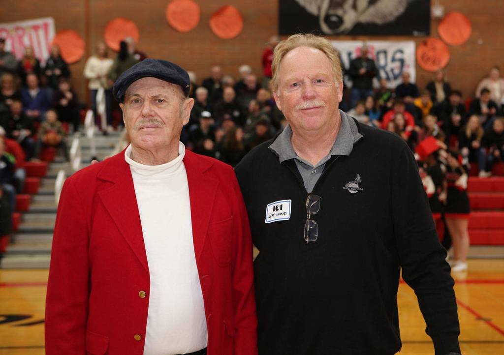 Coach Bob Barker, left, and Jeff Stone are two key parts to Coupevilles district championship team from 1969-70. Stone is tied for the most points in school history and has the school record for most points in a game and a season.(Photo by John Fisken)