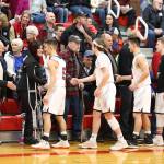 The current Coupeville players shake hands with the past athletes last Friday.(Photo by John Fisken)