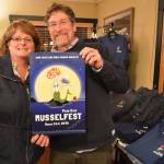 Photo by Megan Hansen/Whidbey News-Times                                Scott and Kerry Rosenkranz of Rosenkranz Productions show off the poster they created for this years Penn Cove Mussel Festival.