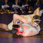 Oak Harbors Ethan Pace, top, controls Stanwoods Josh SanCartier. Pace went on to win the match 11-2.(Photo by John Fisken)