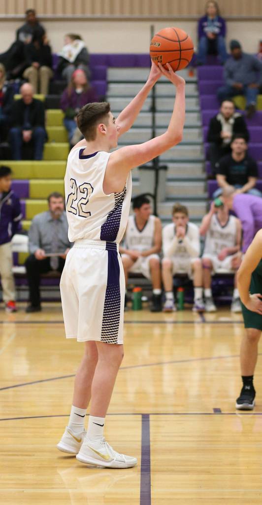 Brennon Ney sinks a free throw for Oak Harbor.(Photo by John Fisken)