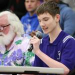 Oak Harbor High School senior Tyler Penney, left, shares the public address duties with Jay Long, left, at the Wildcat boys basketball game Wednesday. Penney, the team manager, would like to pursue a career in sports broadcasting. (Photo by John Fisken)
