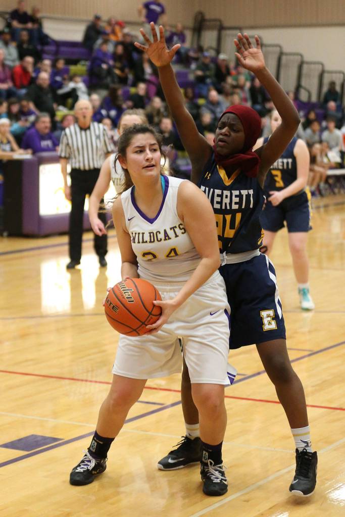 Jordan Wood-Pina tries to work around the defense of Everetts Amina Hussein.(Photo by John Fisken)