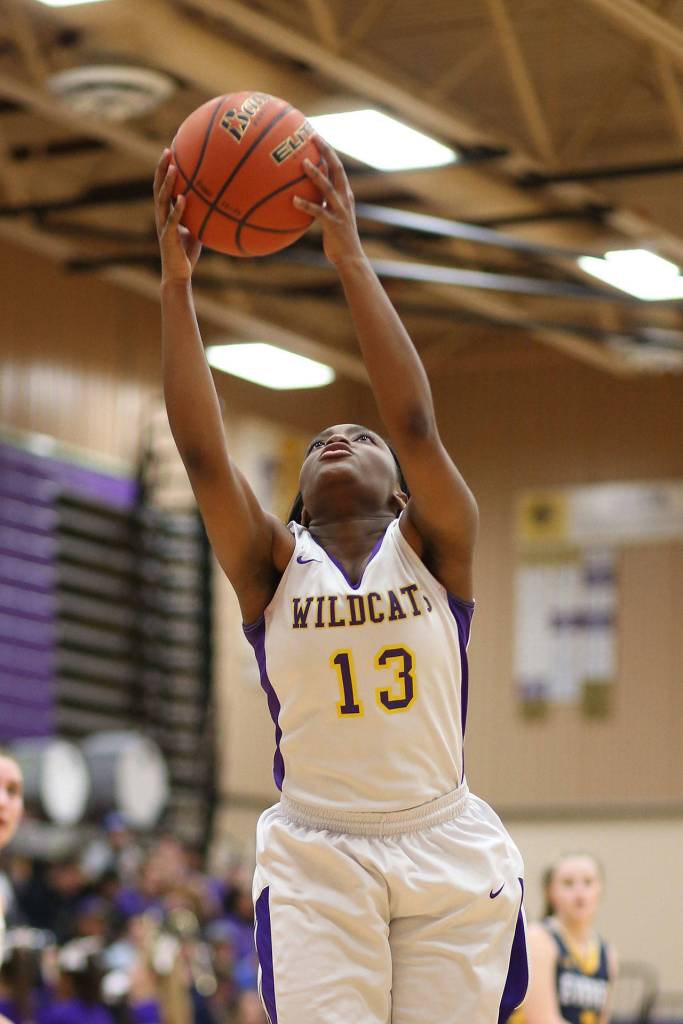 Delija Cammon snares a rebound against Everett Friday.(Photo by John Fisken)