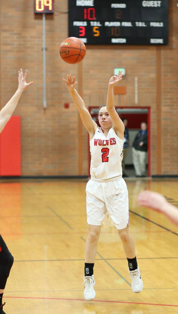 Scout Smith launches a long shot for the Wolves Friday.(Photo by John Fisken)