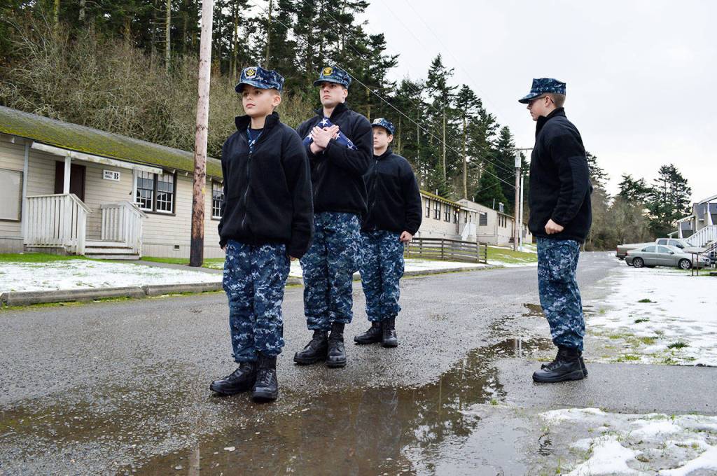 Front, cadets Joshua Merry, Almazano Bergeron and Maxim Tretiakov receive instructions from Travis Finning as they practice a flag ceremony. The group participated in Navy Sea Cadet Winter Training last week at Camp Casey. Photo by Laura Guido/Whidbey News-Times