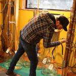 Mike Huffman, general manager of Whidbey Island Distillery, checks the unique still system created for its whiskey and liqueurs. Visitors will learn about the drip irrigation invention as part of the Wine, Spirits and Chocolate Tour. Photos by Patricia Guthrie/Whidbey News-Times