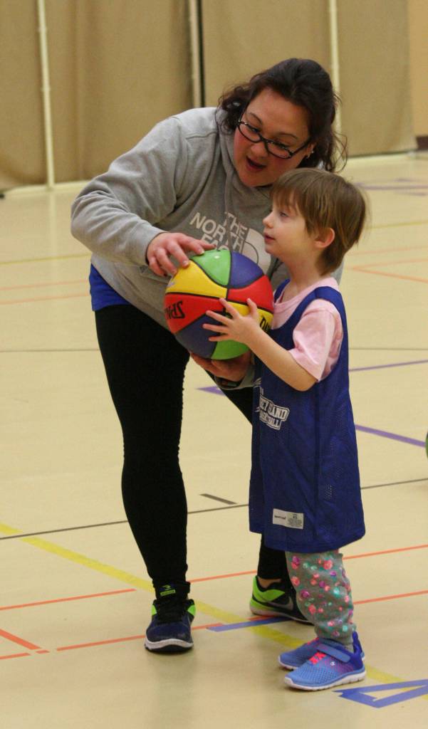 Coach Robyn Bainbridge helps Suzanna Goulet with her shooting technique.(Photo by Jim Waller/Whidbey News-Times)
