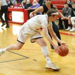 Ethan Spark runs down a loose ball for the Wolves.(Photo by John Fisken)