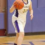 Madison Maxwell looks for an open teammate against Meadowdale Monday.(Photo by John Fisken)