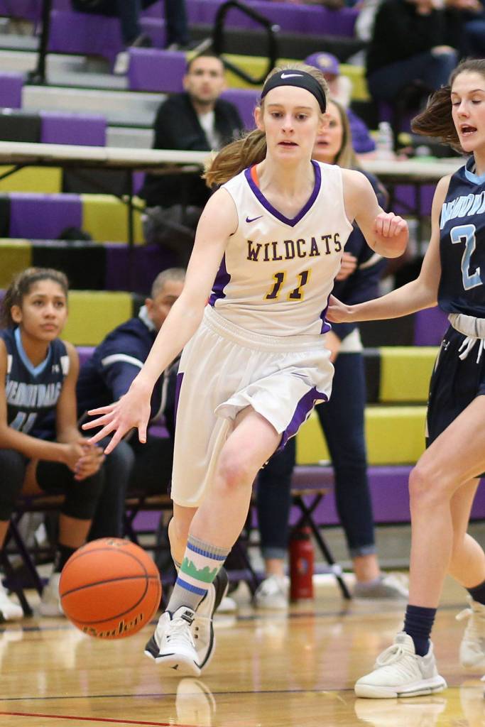 Olivia Waite slips by her Maverick defender Monday.(Photo by John Fisken)