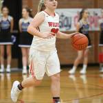 Avalon Renninger brings the ball up the floor for the Wolves Saturday.(Photo by John Fisken)