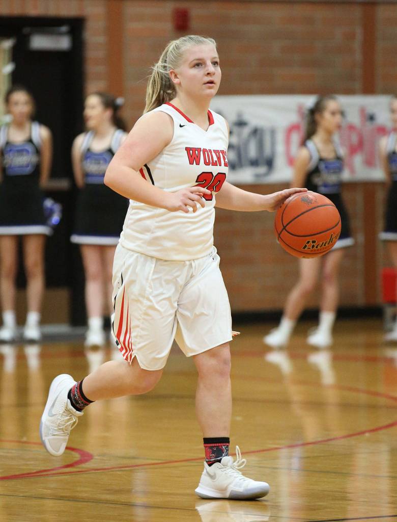 Avalon Renninger brings the ball up the floor for the Wolves Saturday.(Photo by John Fisken)