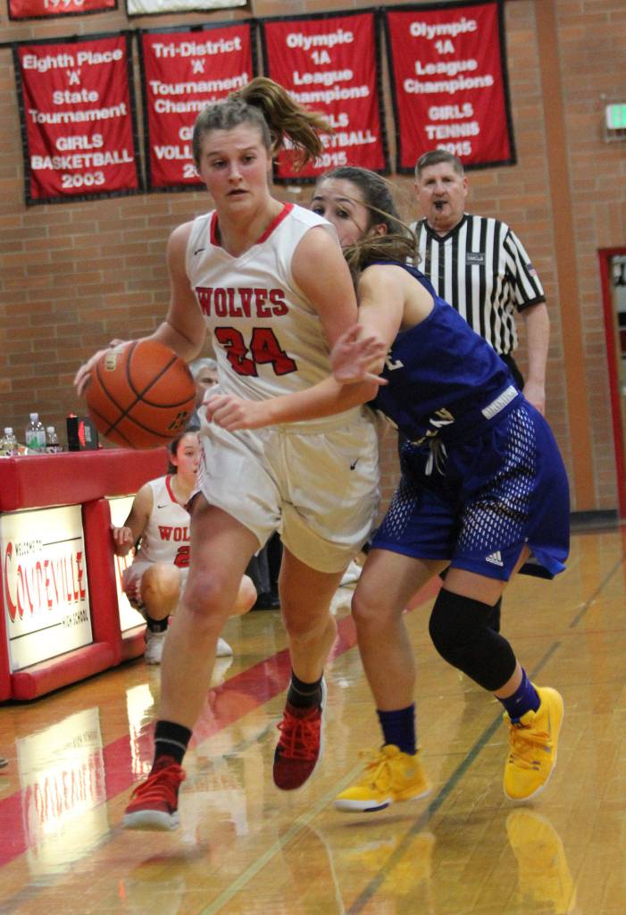 Coupevilles Lindsey Roberts, left, blows by BCs Catherine Dugoni.(Photo by Jim Waller/Whidbey News-Times)