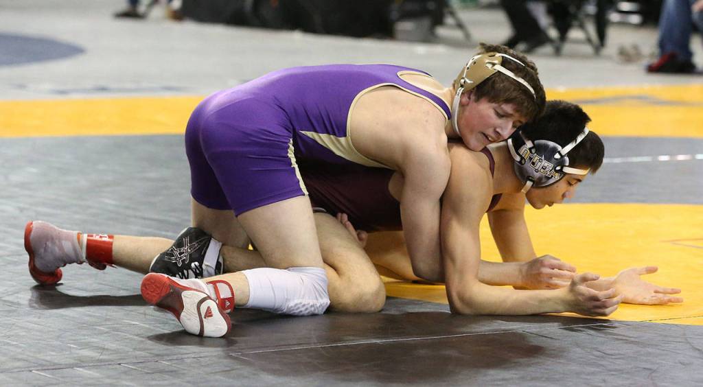 Blake McBride, top, controls Nate Balinbin of ODea. (Photo by John Fisken)