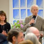 Auctioneer Jim Freeman, right, immerses himself in the crowd during the live auction, pausing by Sandy and Bill Johnson to take some bids. Photo by Megan Hansen/Whidbey News-Times