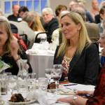 Shelli Trumbull, left, laughs during a rousing bid war for cooking lessons with Knead and Feed owner and Lion Doug Kroon. Photo by Megan Hansen/Whidbey News-Times