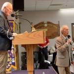 Bob Clay, left, served as an emcee along with auctioneer Jim Freeman, right.