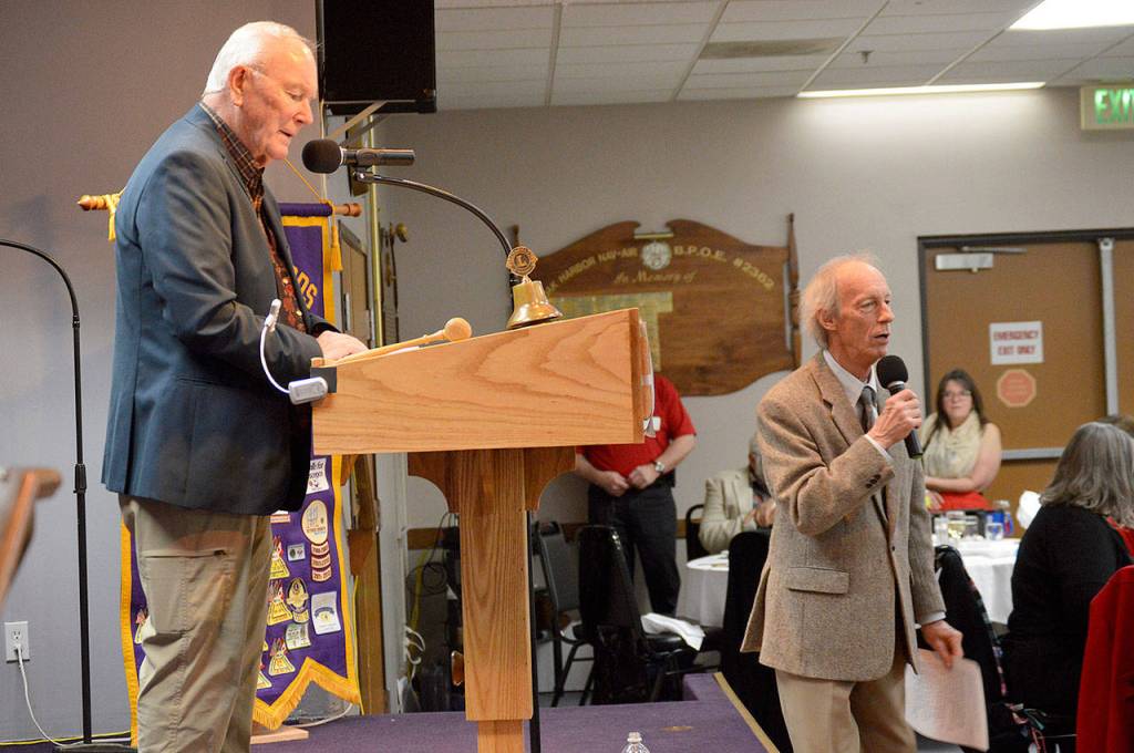 Bob Clay, left, served as an emcee along with auctioneer Jim Freeman, right.