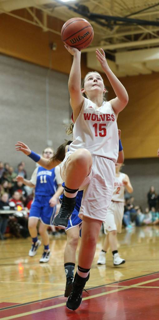 Izzy Wells lays in a shot for the Wolves eighth-grade team.(Photo by John Fisken)