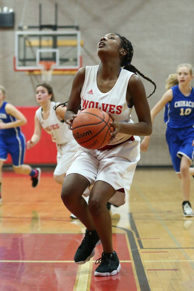Eighth-grader JaKenya Hoskins powers up for a shot for Coupeville. (Photo by John Fisken)