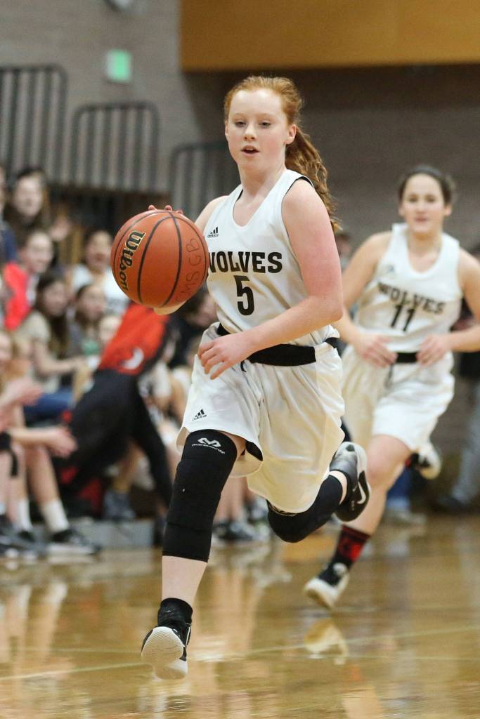 Maddie Georges leads the Coupeville seventh-graders fastbreak.(Photo by John Fisken)