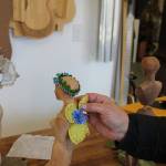 Janet Lewis, who usually makes high-end wooden instruments, has been having fun finding ways to decorate three wooden figures she carved. Its been a real freeing process, Lewis said.