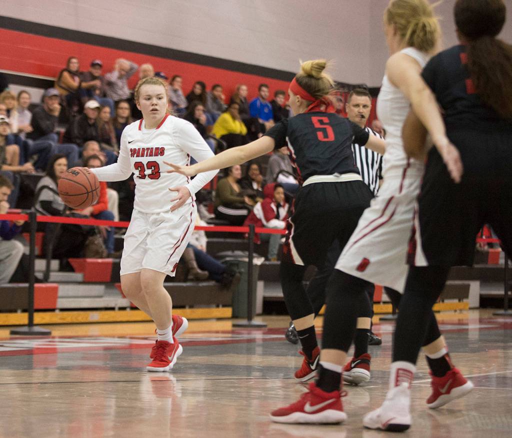 Coupevilles Kailey Kellner (33), playing for DYouville College, looks to the post in a game this season. (Photo courtesty of DYouville Athletics)
