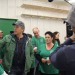 Garage of Blessings and founder Kristiina Miller (center) takes Mike Rowe (left) on a tour of the nonprofit. Rowe surprised Miller with money, an expanded renovated space, new office and a van in November. They are being filmed for the Facebook series, Returning the Favor. The episode aired recently.