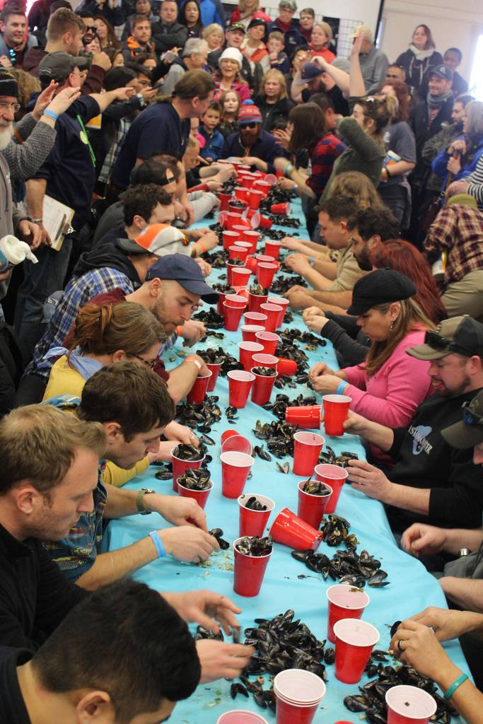 In the Coupeville Rec Hall Saturday, feisty competitors chow down three cups of steamed mussels in pursuit of the coveted Mussel Eating Champ title.