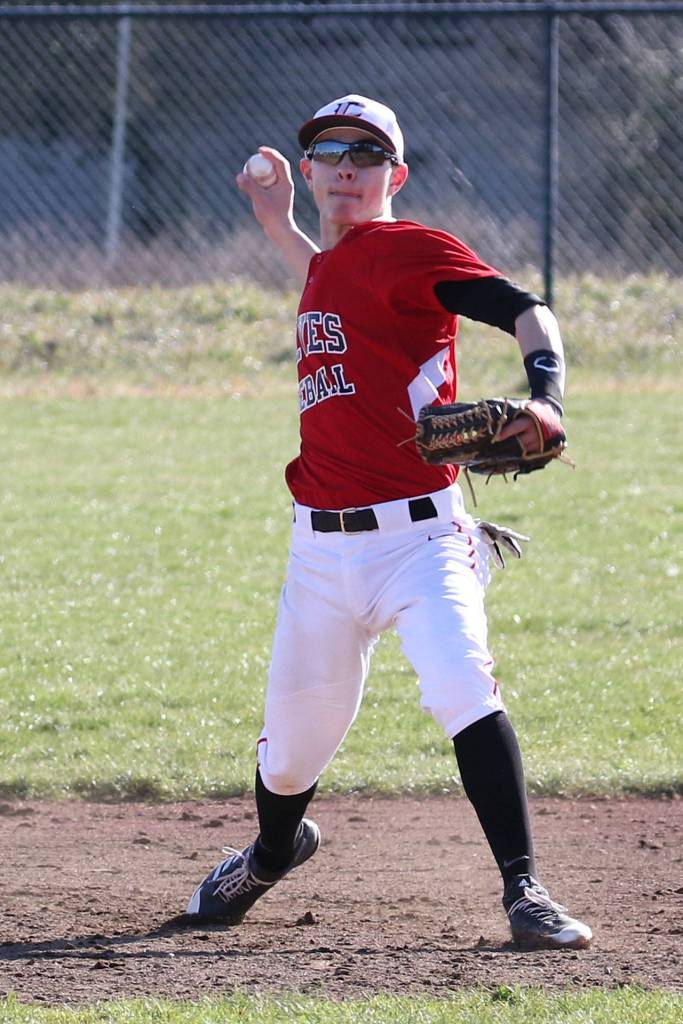 Shortstop Hunter Smith throws to first to force out an Lynden Christian hitter.(Photo by John Fisken)