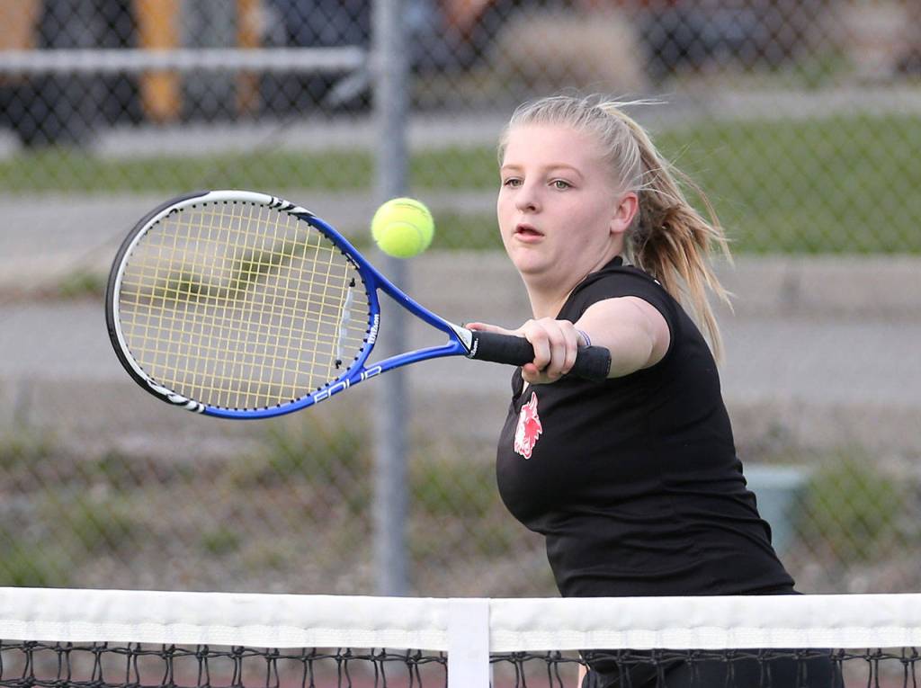 Avalon Renninger swaps a backhand in her second doubles win Monday.(Photo by John Fisken)