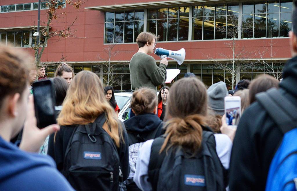 Sophomore Keelie Partridge speaks at the school walkout Wednesday in front of Oak Harbor High School. She and other students who spoke urged the audience to call their local representatives to advocate for stricter gun control in the wake of the shooting at Marjory Stoneman Douglas High School. Photo by Laura Guido/Whidbey News-Times