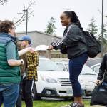 Desirae Payne hands out voter registration forms to students who are 18 or who will be by the November election. Photo by Laura Guido/Whidbey News-Times